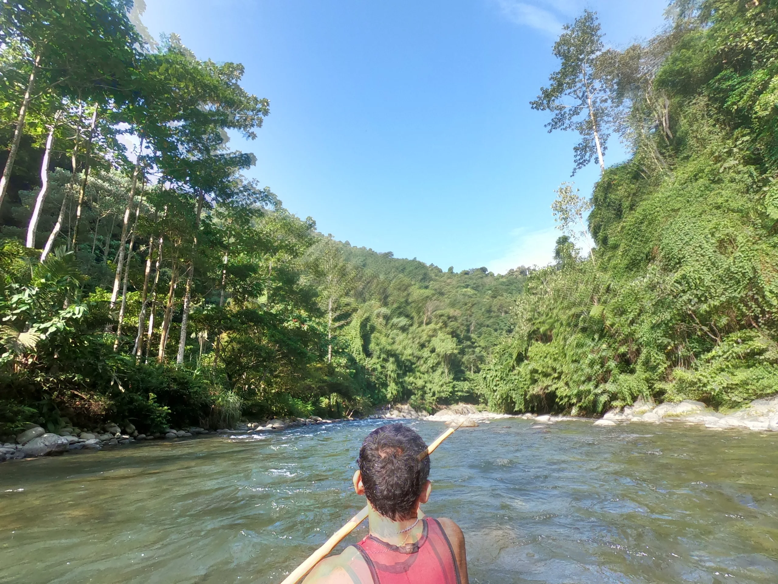 The cook at the front of our raft, Jungle trek Sumatra Indonesia