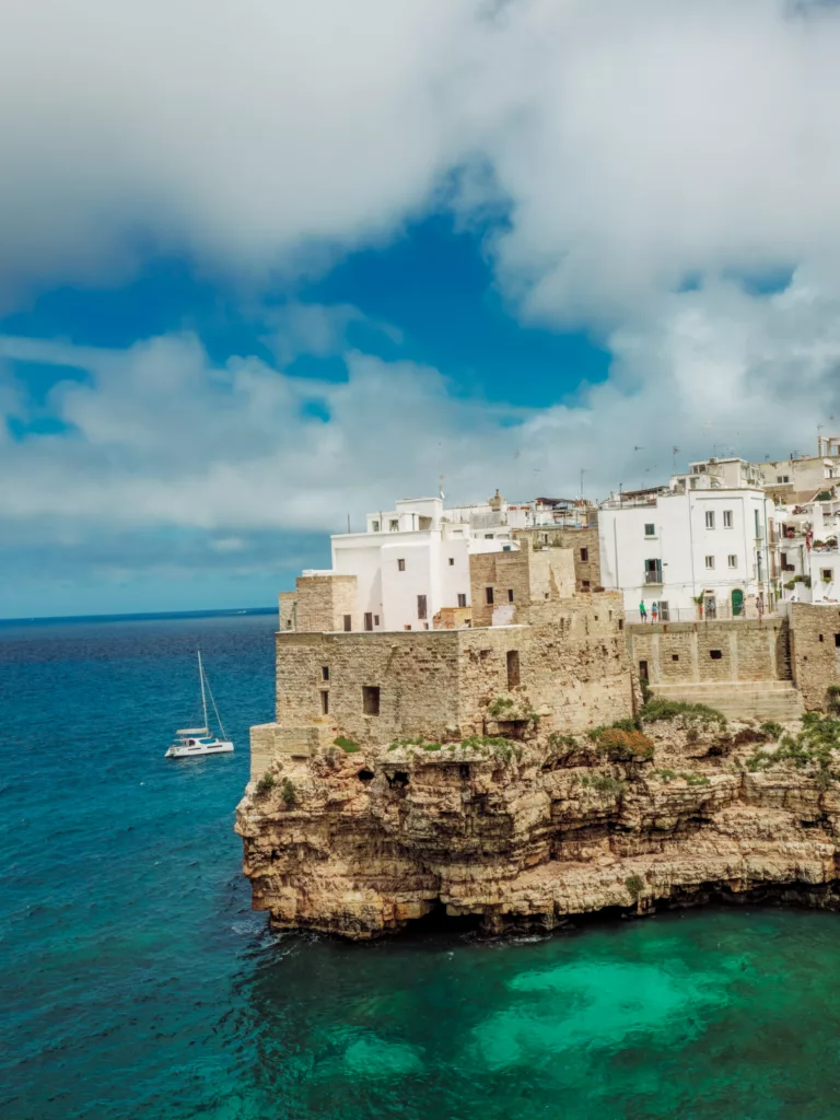 Boats touring the grottos and beaches of Polignano a Mare, Puglia