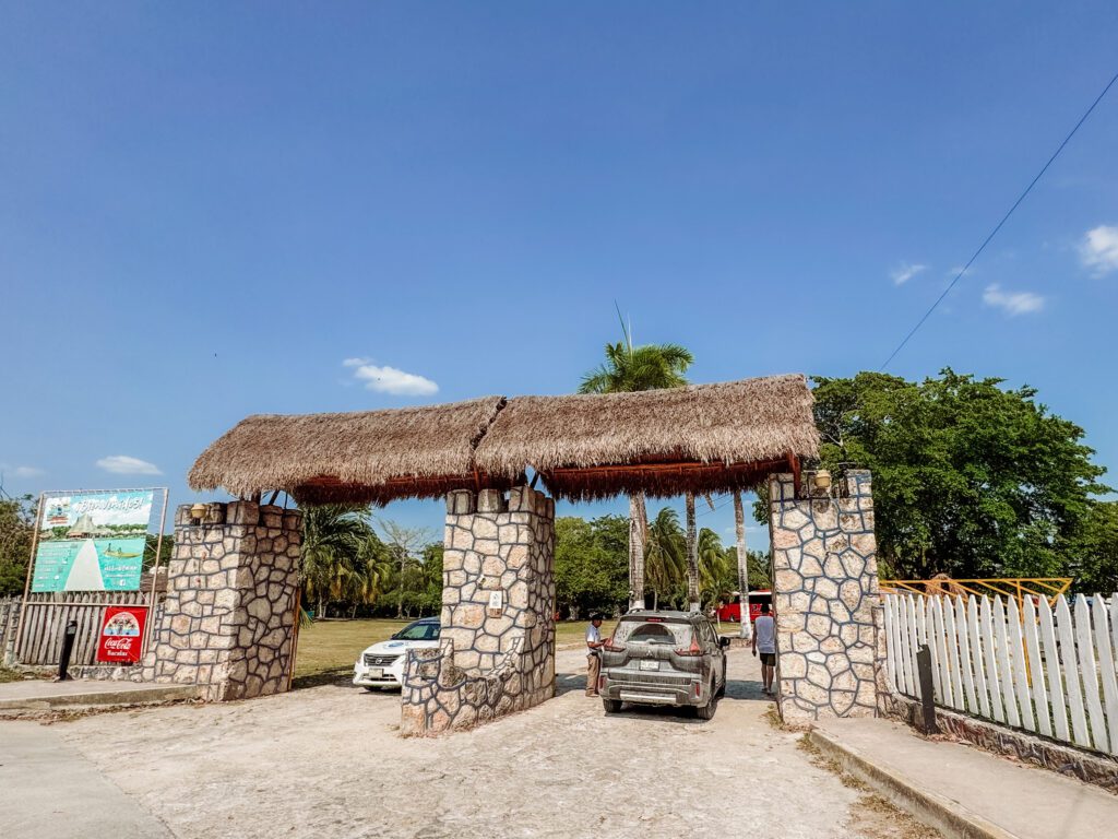 entrance to the beach club with best empanada lady