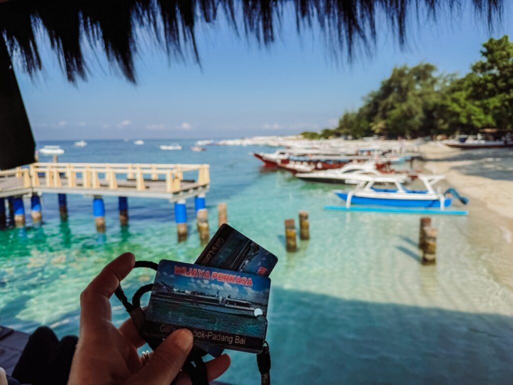 buying our boat tickets to Bali while on Gili Air