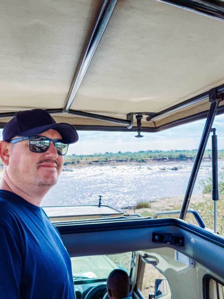 Mike overlooking Mara River from the safari jeep