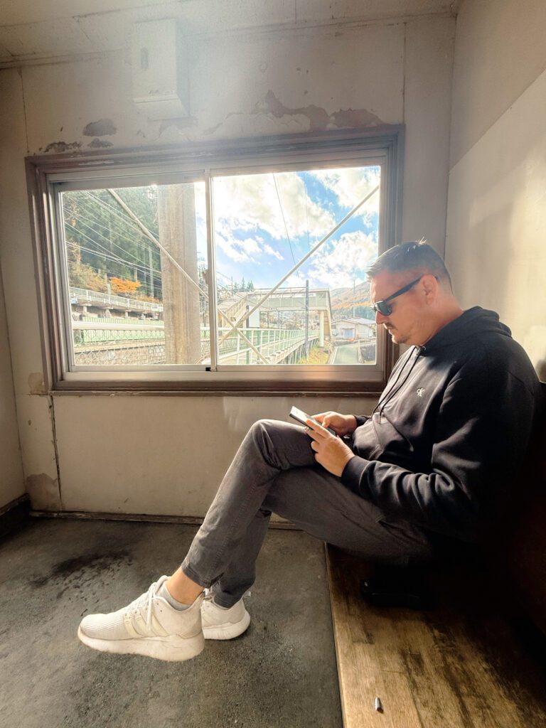 Mike waiting for the little train back to Matsumoto