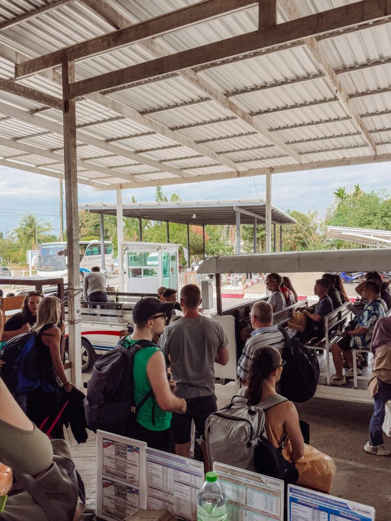 Getting on the little carts that take you from the Trat Boonsiri depot to the ferry boat