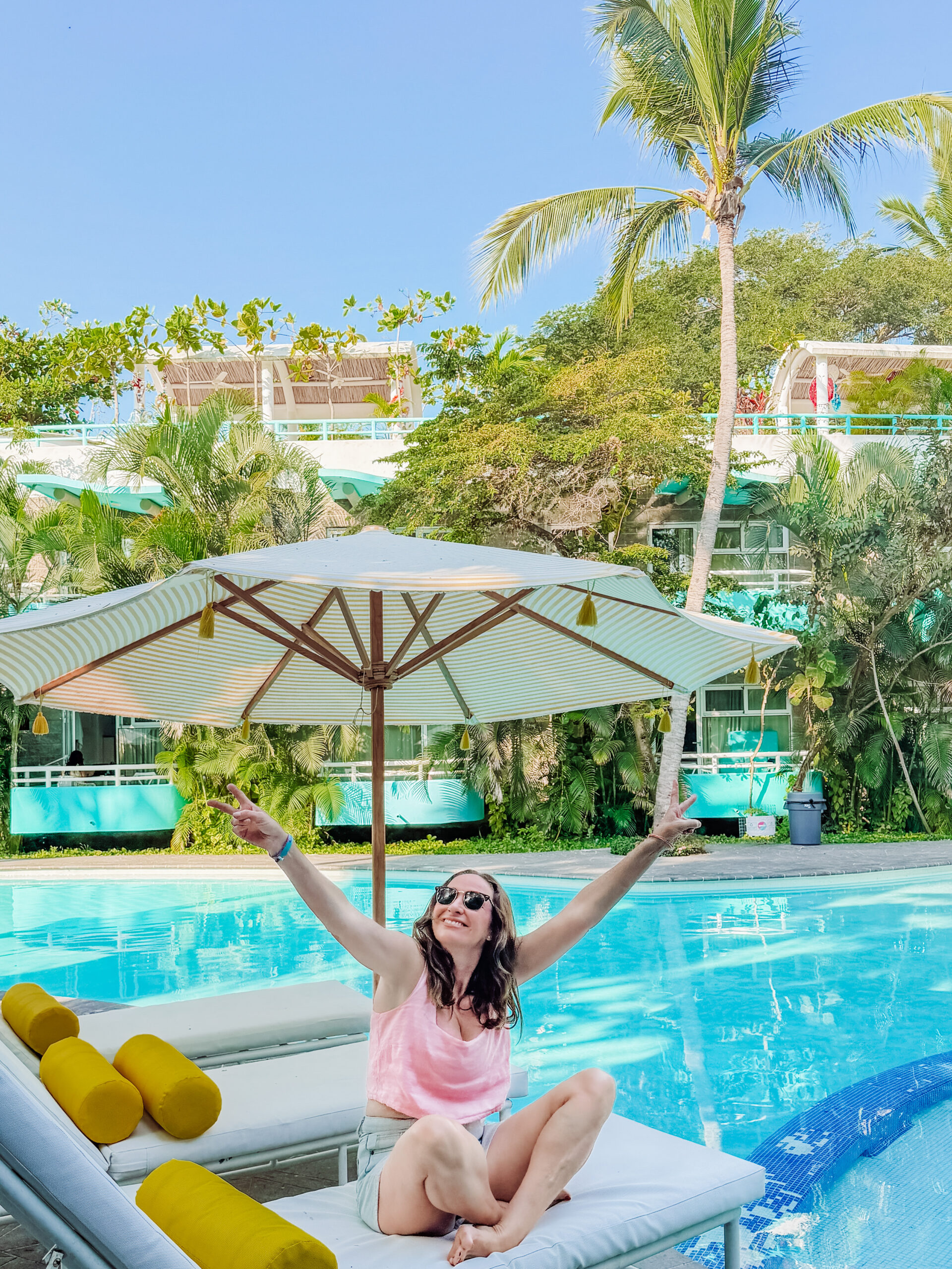 kelly enjoying the pool area of azul pitaya beachfront hotel in sayulita, mexico