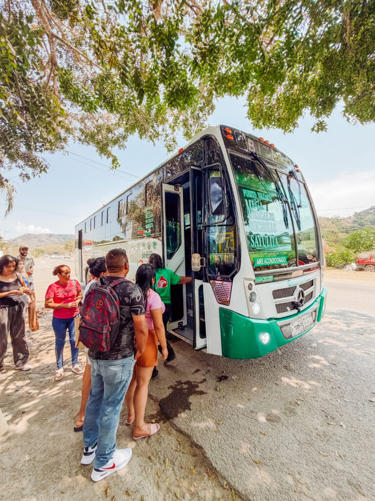 kelly and mike catching the bus from san pancho back to sayulita in riviera nayarit mexico