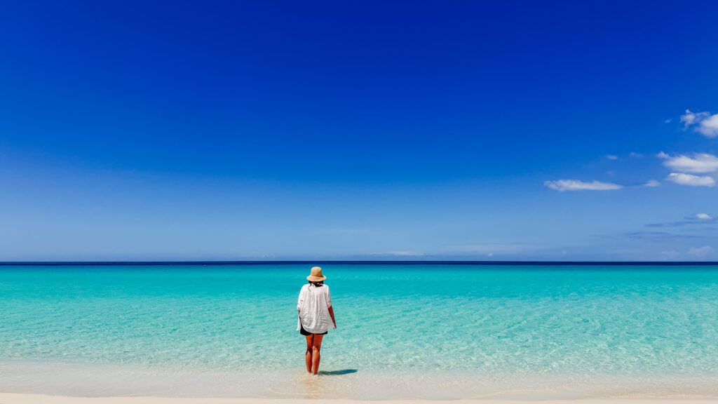 kelly walking along the perfect seven mile beach in negril jamaica