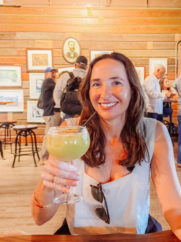 kelly with a pina colada at ron barrilito distillery, san juan