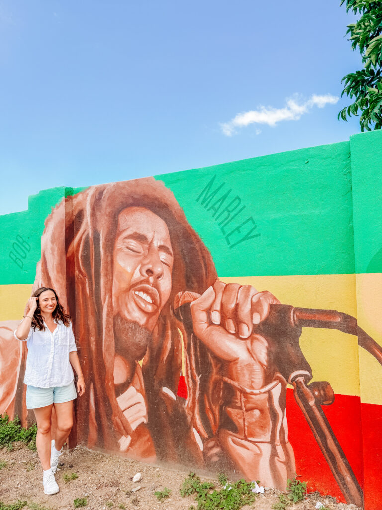 kelly with street art in trench town kingston jamaica