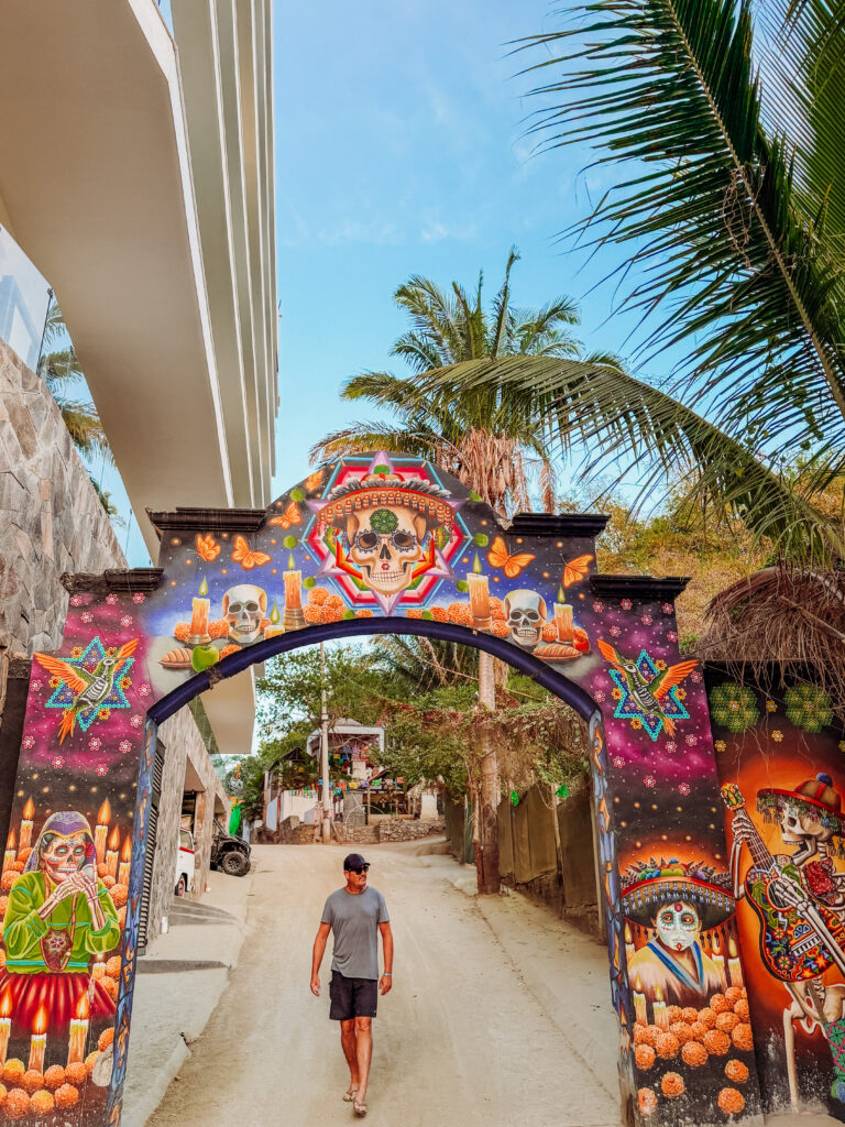 kelly at entrance to playa del los muertos sayulita mexico