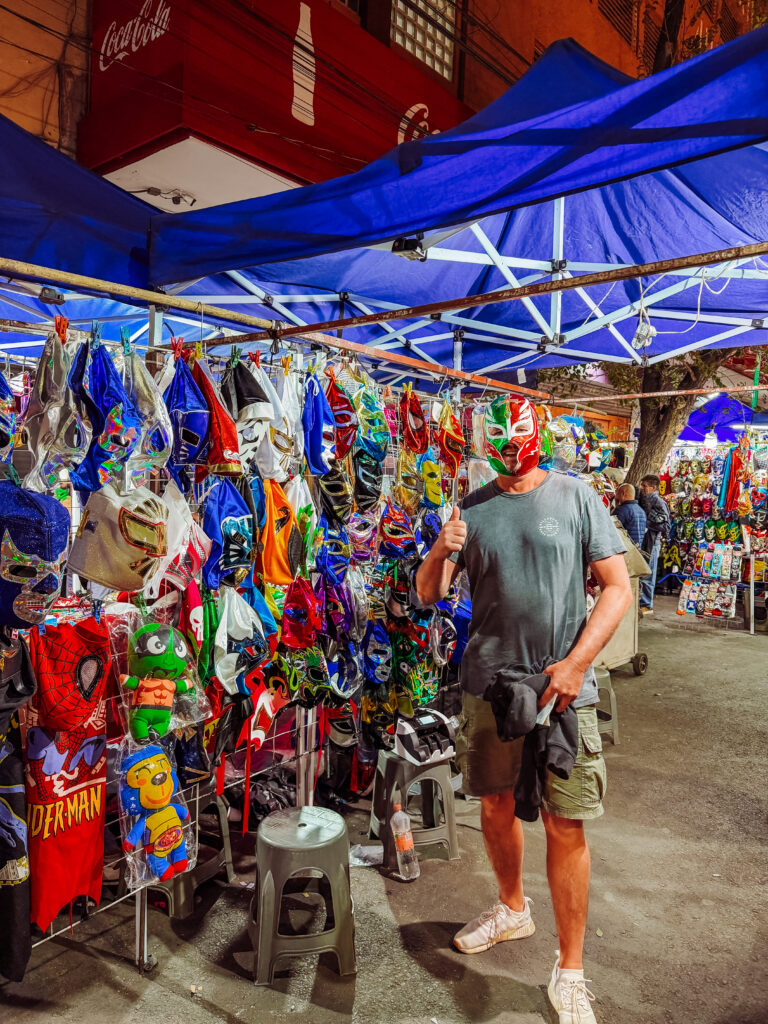 mike buying a luche libre mask in mexico city