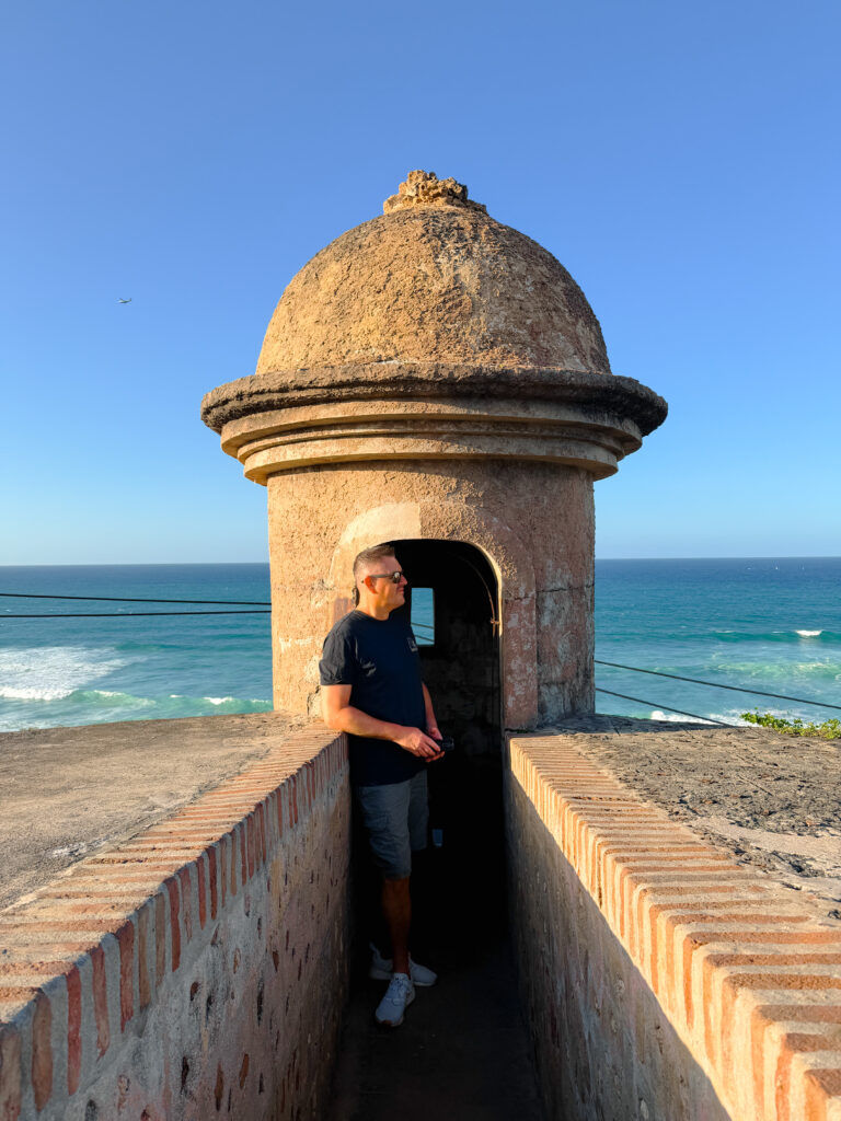mike at the towers overlooking the sea in san juan