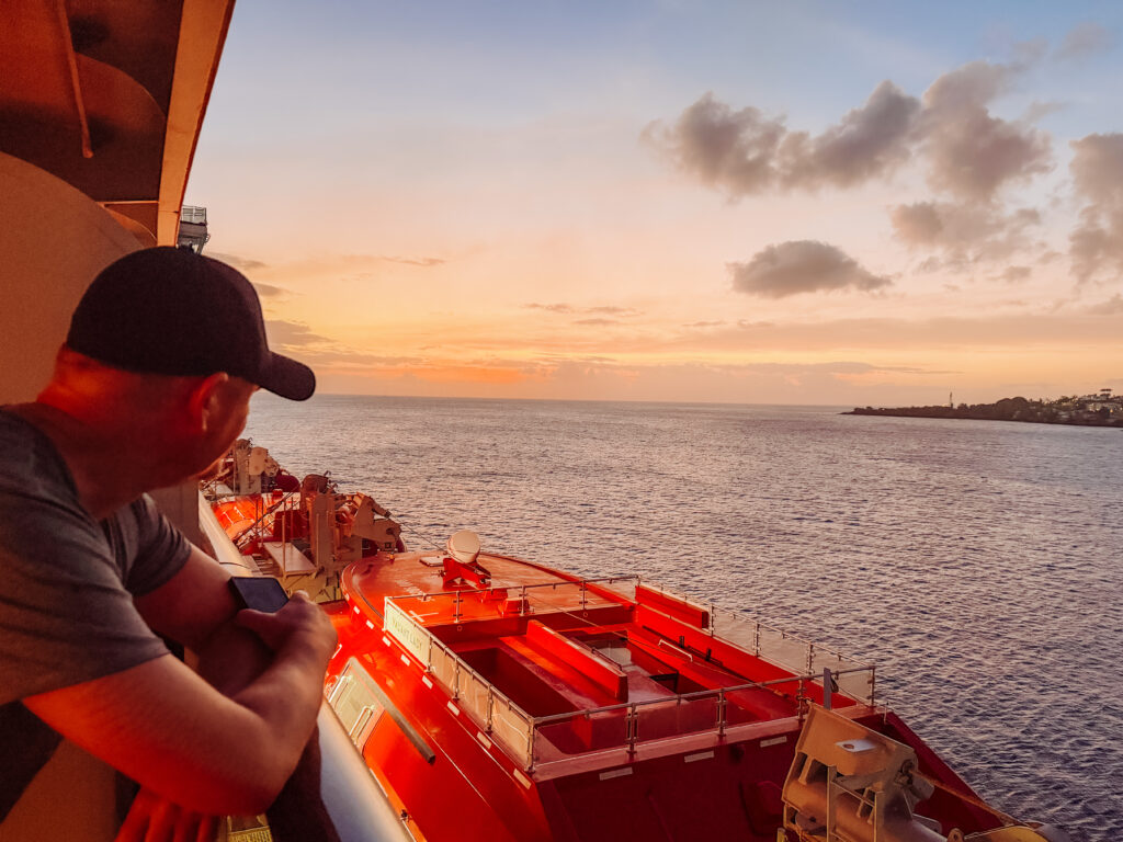 sunset views from our virgin voyages balcony on caribbean cruise