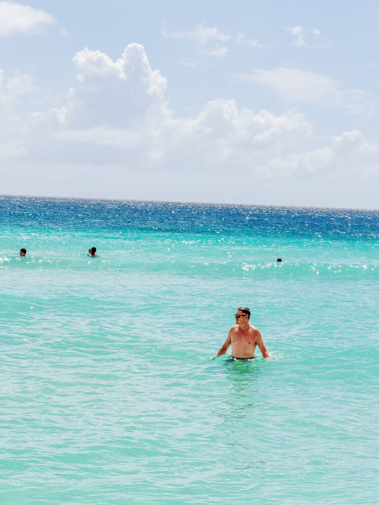 mike swimming in the clearest water at dominicus beach, bayahibe, dominican republic