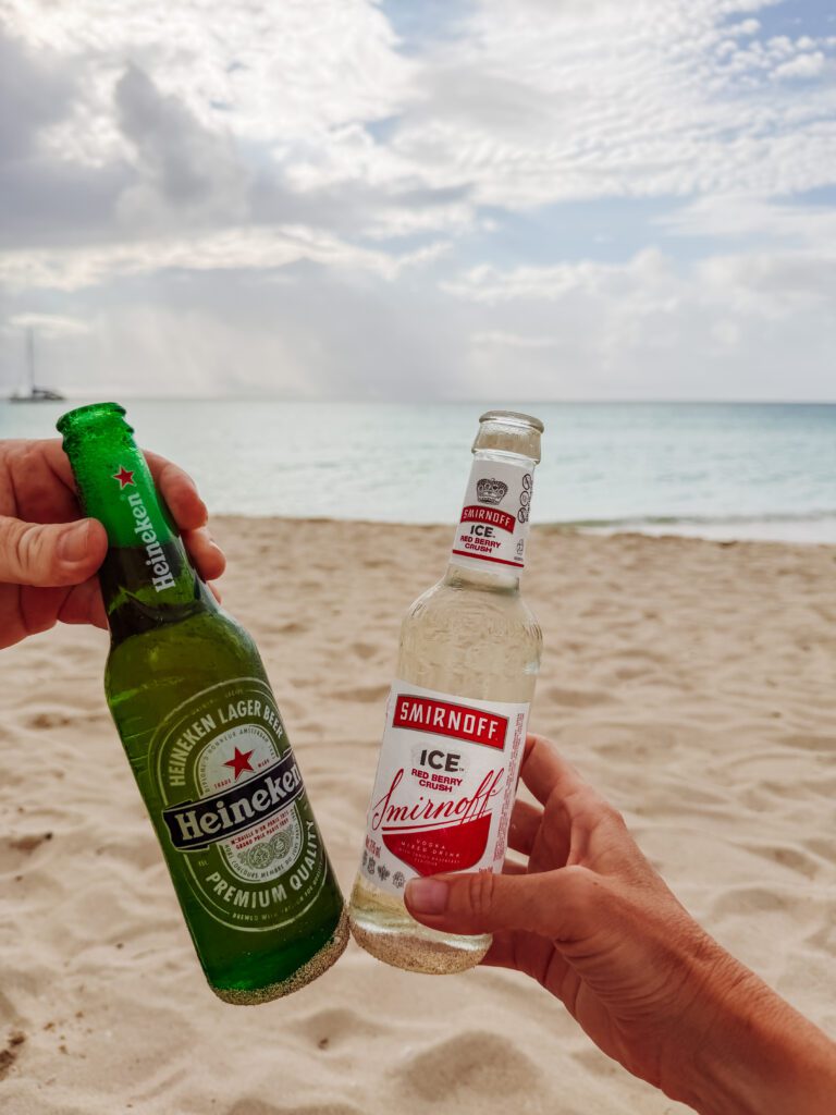 drinks in the sand and sunset over negril beach