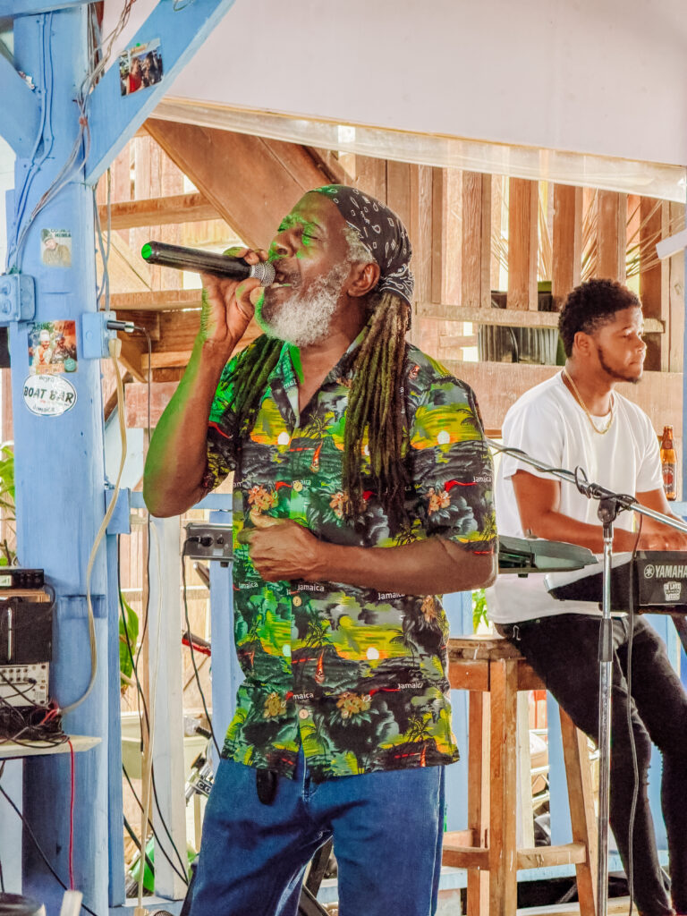listening to live reggae music in the boat bar on negril beach jamaica