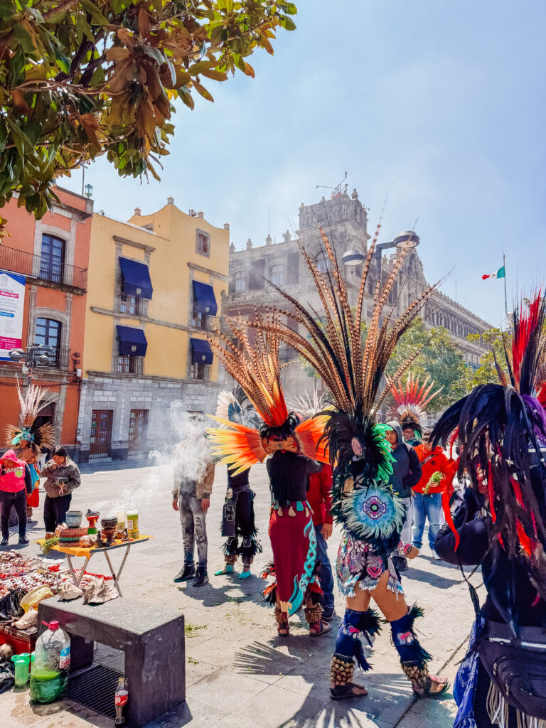 sharmen performing a cleansing ritual in mexico city next to the cathderal