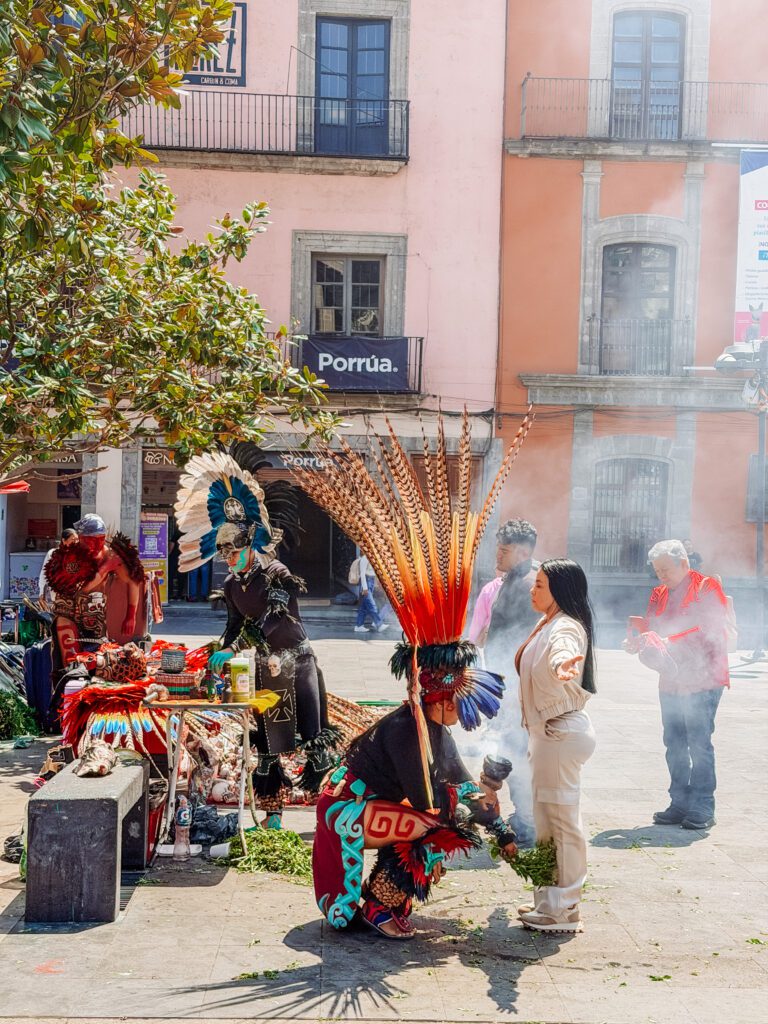 sharmen performing a cleansing ritual in mexico city next to the cathderal