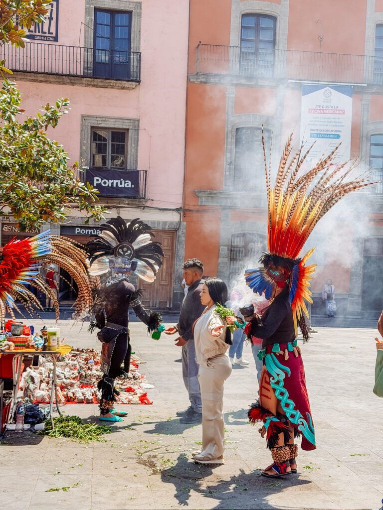 sharmen performing a cleansing ritual in mexico city next to the cathderal