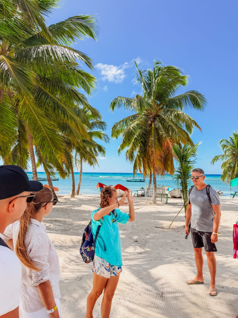 mike listening to tour guide on tour of saona island