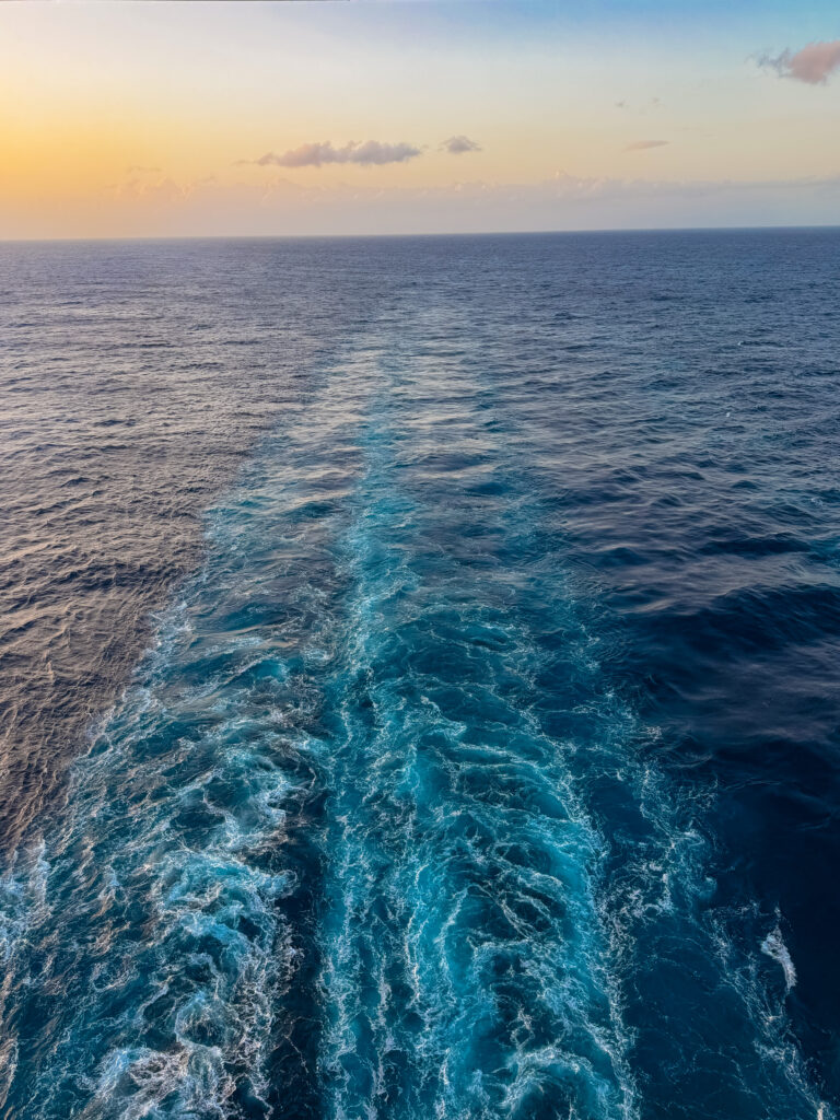 sun set over the water on our sea day with virgin voyages cruise