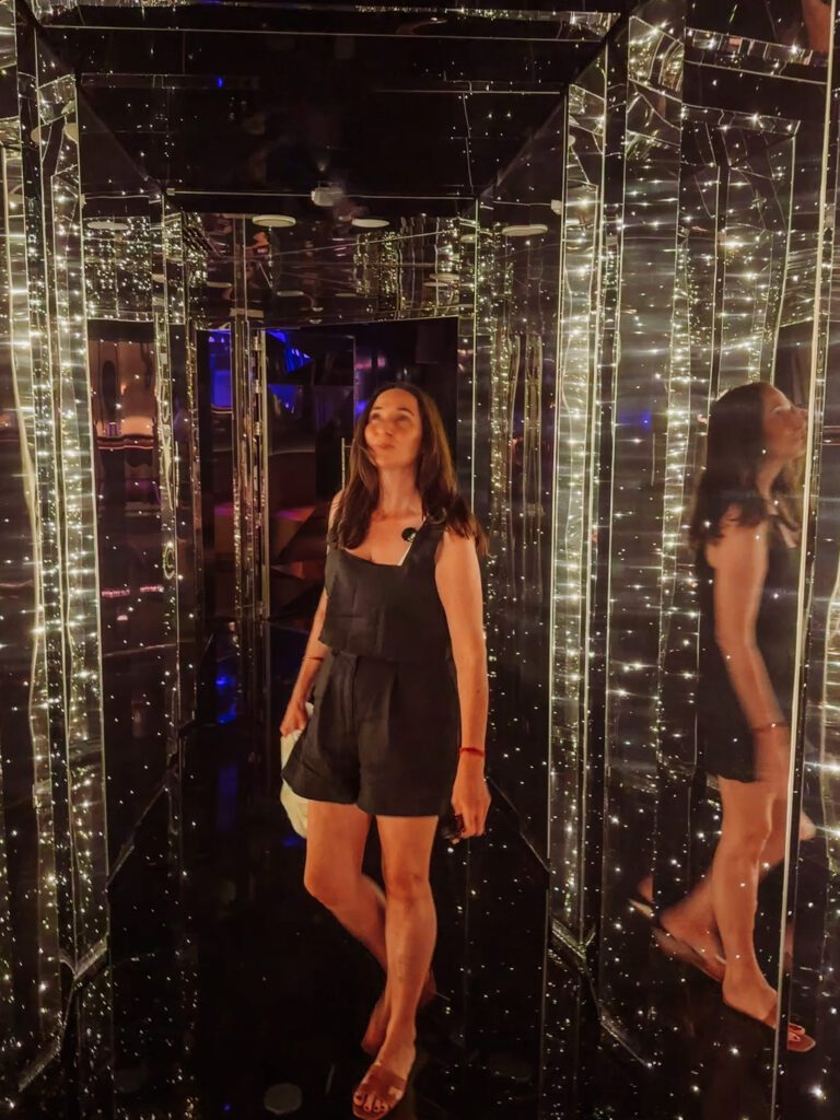 kelly at the entry to the lounge in virgin voyages