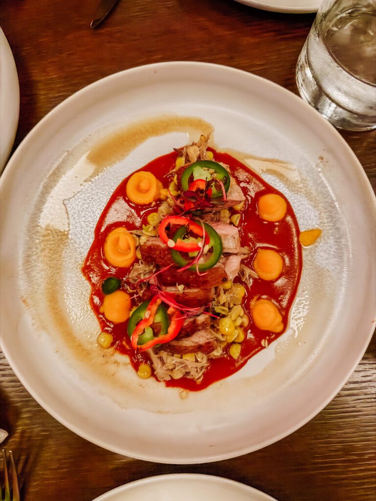 gluten free duck dish in pink agave virgin voyages