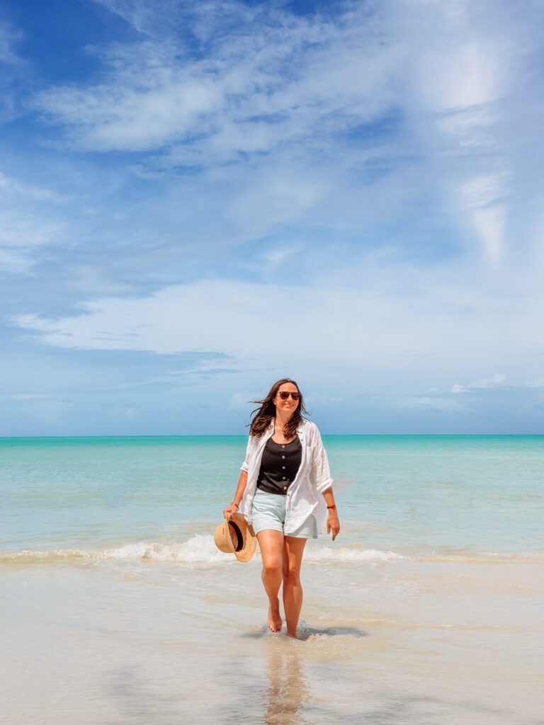 kelly walking in the beach in antigua