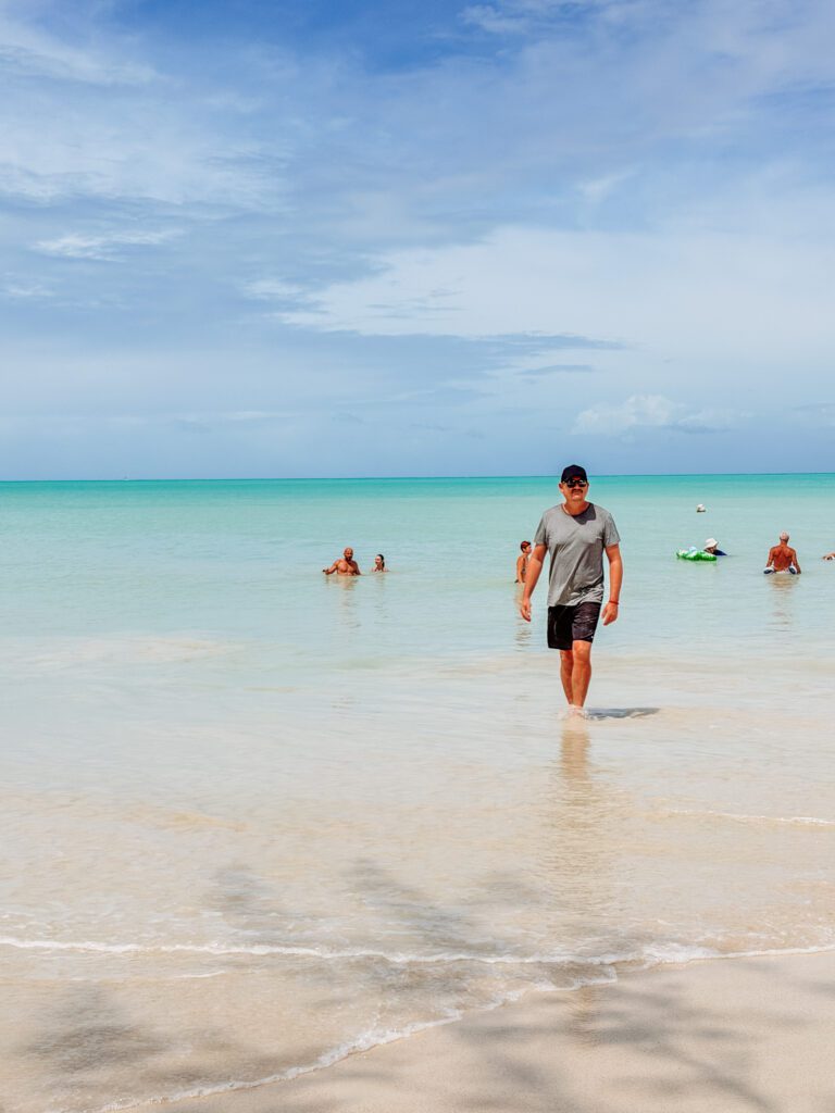mike walking along dickensons beach antigua