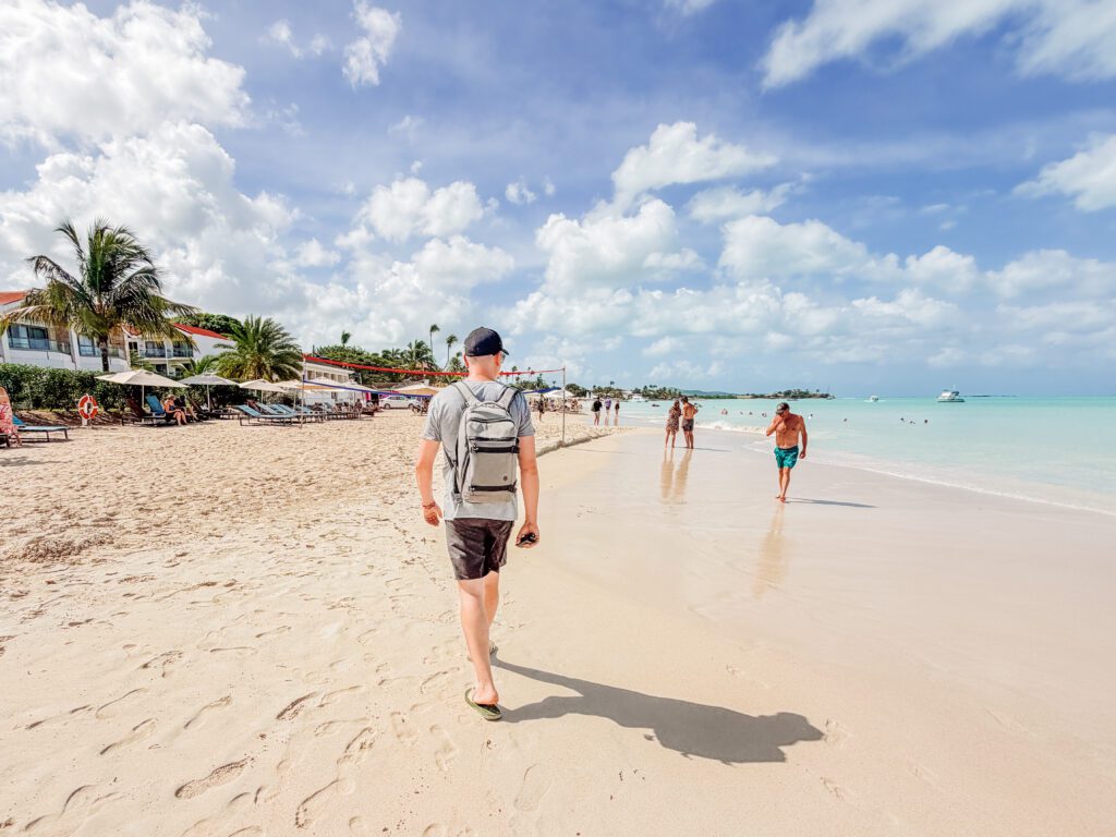 mike strolling along the beach of antigua