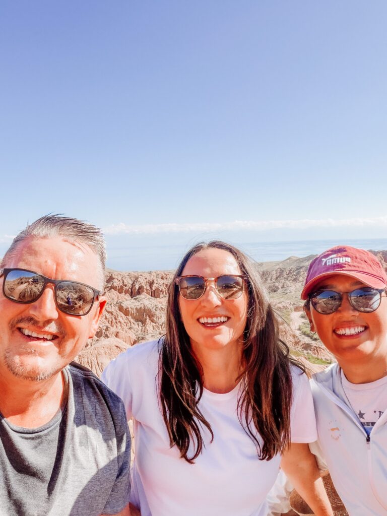 mike, kelly and our guide from kyrgyz riders at the viewpoint at fairytale skazka canyon