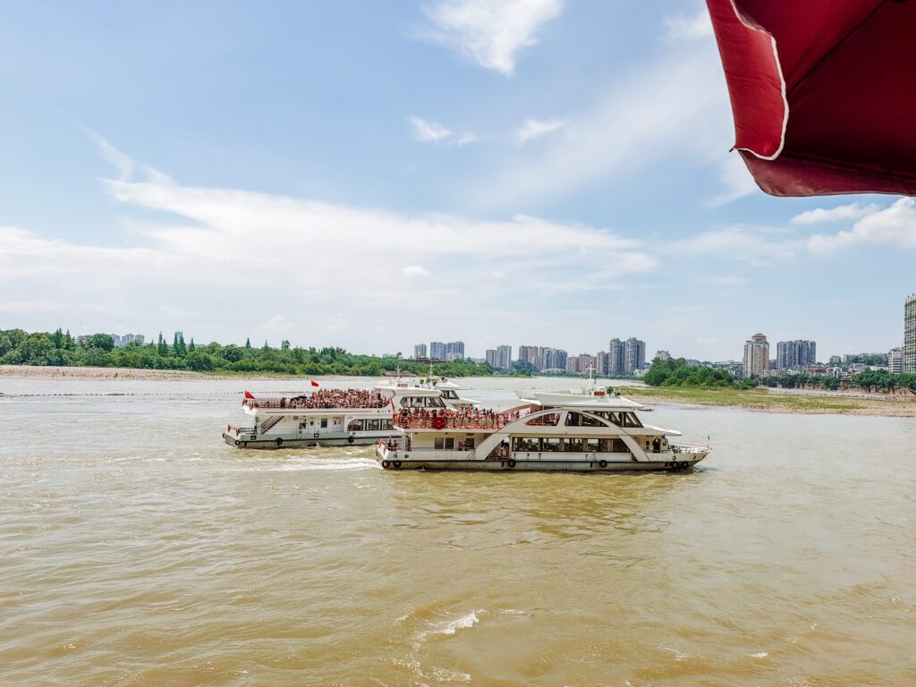 the boats at the leshan giant buddha feet area. you will get a front of view from the boat