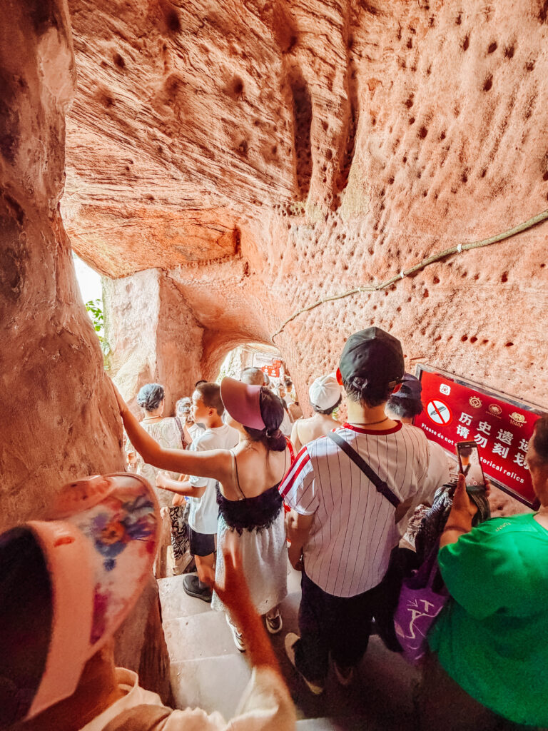 walking through the cave part of the path along the buddha at leshan