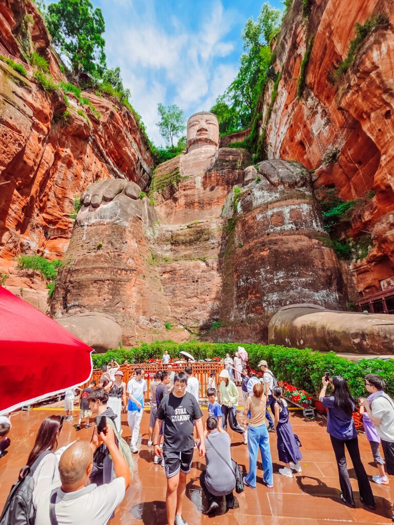 everyone taking pictures at the giant buddha