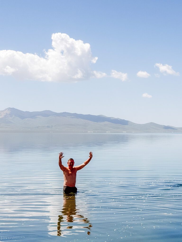 mike swimming in song-kul lake after horse riding
