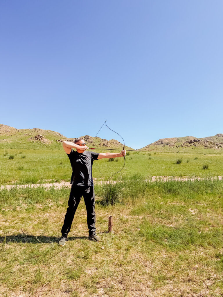 mike doing archery in Kyrgyzstan
