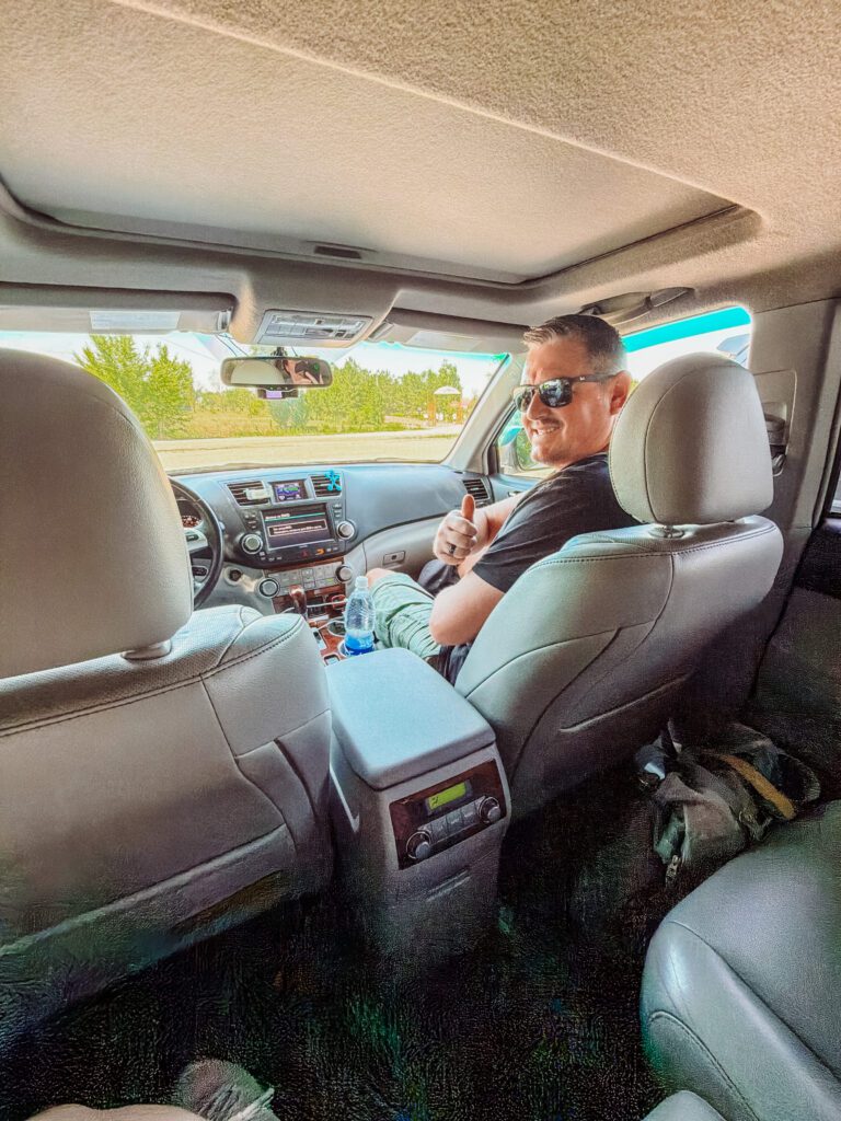 Mike in the front of our kyrgyz riders tour car