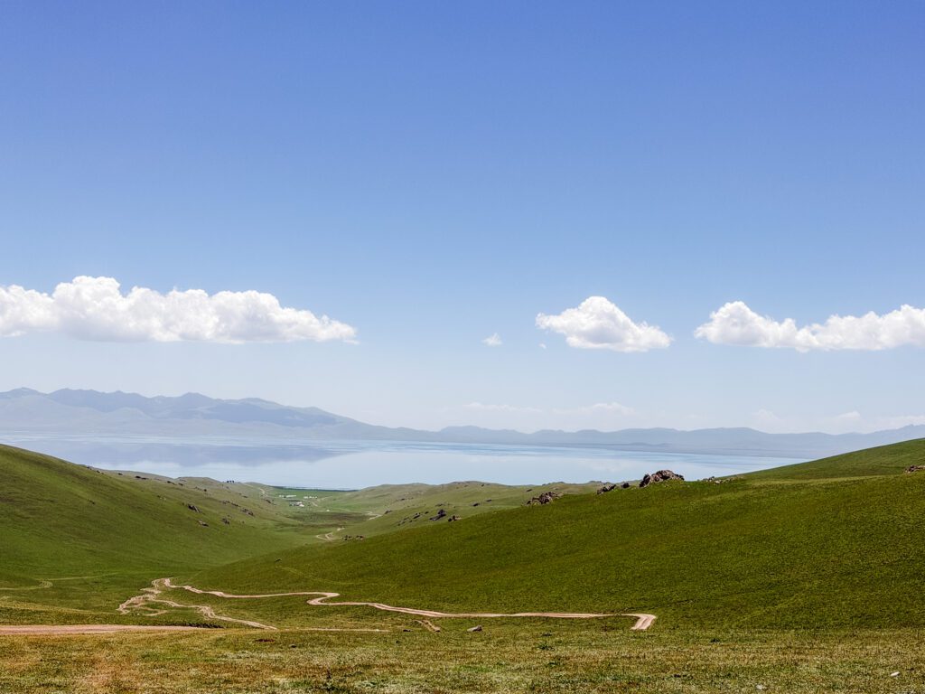 view to song kul lake from mountain pass