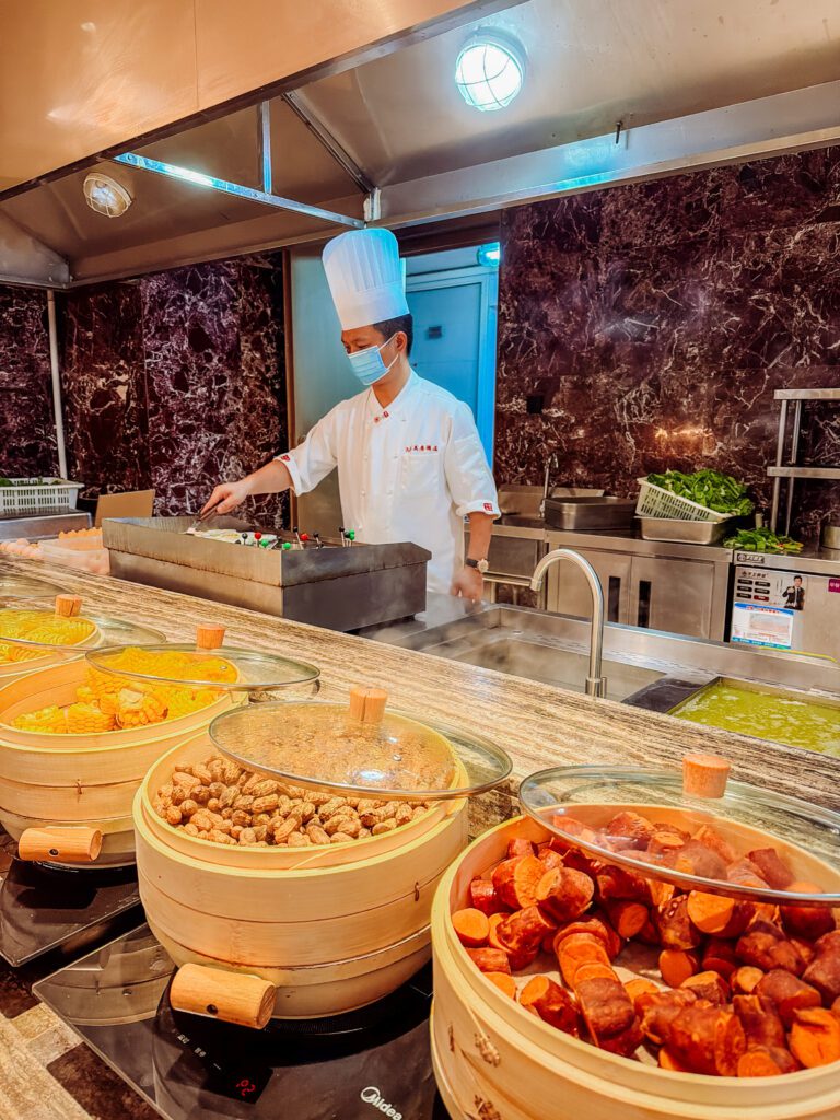noodles being cooked at breakfast at mercure chengdu